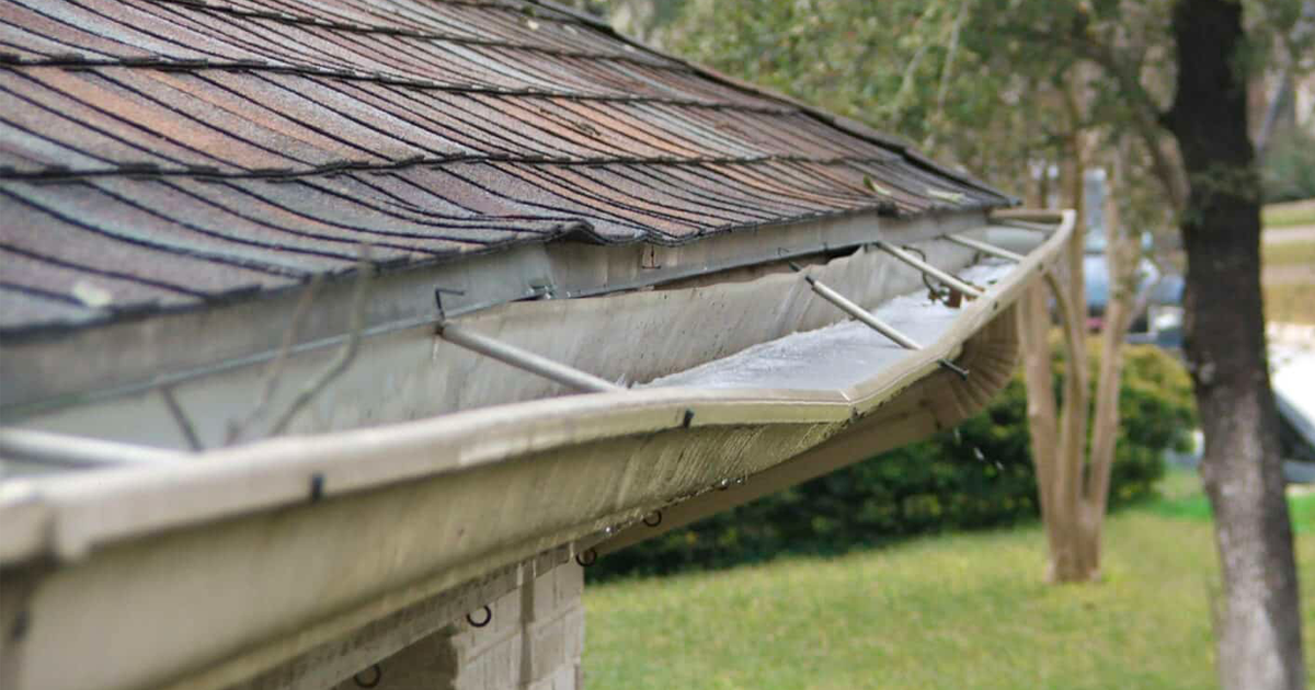 Durable K-Guard gutters safeguarding a home from summer weather wear and tear