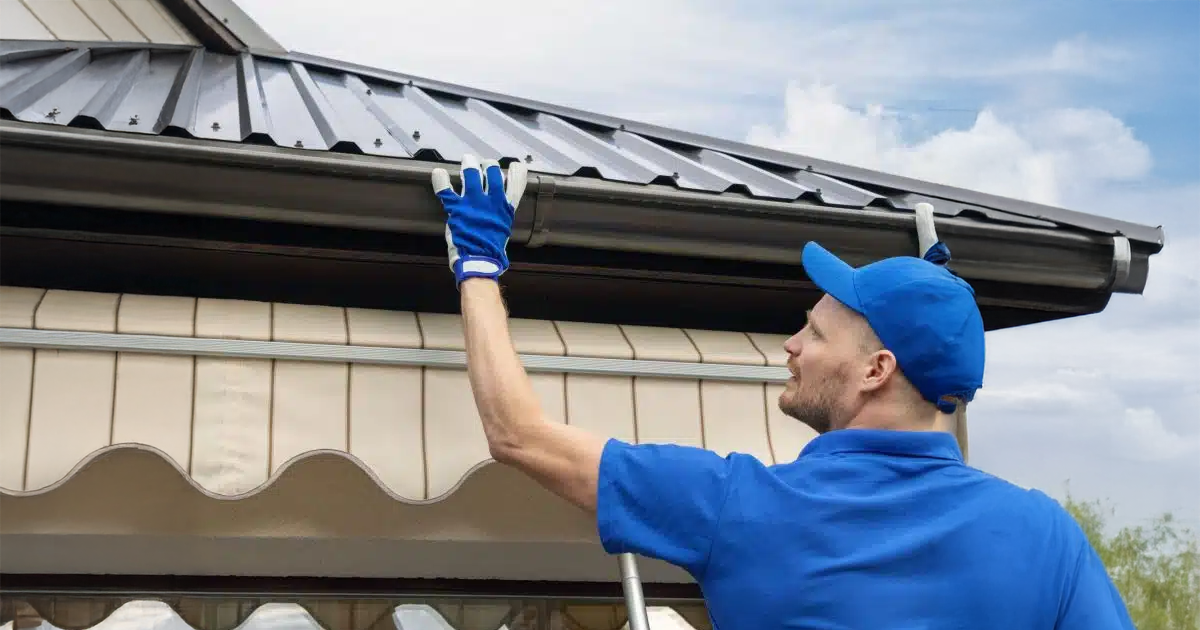 Seamless gutter system installed to prevent winter water damage